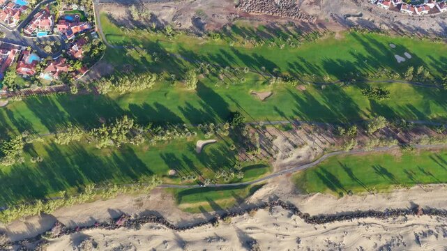 Sunrise over Maspalomas Golf Course and Sand Dunes Nature Reserve, Gran Canaria, Canary Islands - 4K Aerial View