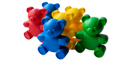 A collection of plastic toy bears in red, blue, yellow, and green colors are stacked together in a pile on a white surface