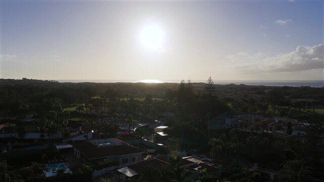 Sunrise over Maspalomas Golf Course and Sand Dunes Nature Reserve, Gran Canaria, Canary Islands - 4K Aerial View