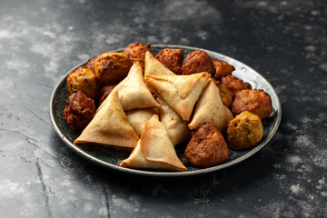 Indian Style Snack Selection with onion bhajis, pakoras and samosas