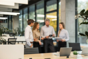 Obraz premium Blurred image of business people standing in the office