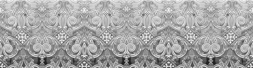 Silver intricate damask seamless pattern background with vintage floral ornaments and metallic texture © MonTeArt