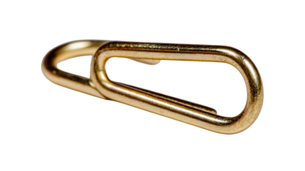 A single gold staple bent metallic wire texture off centered on plain white background for industrial or crafting use with close up and detail