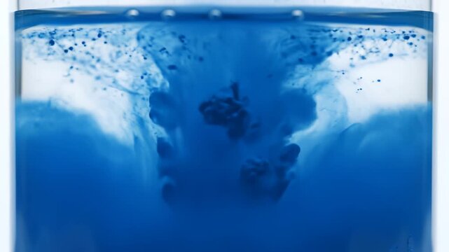 Blue ink dispersing in water