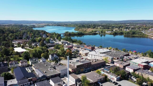 Aerial drone footage of the town of Windsor in Nova Scotia Canada showing typical Canadian houses and the street neighbourhood in the town near the Avon river in the fall autumn time