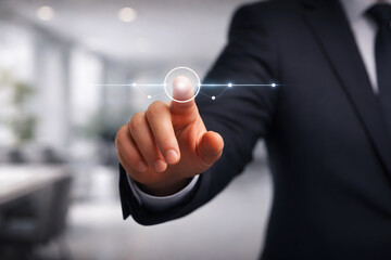 Businessman touching glowing digital interface with fingertip