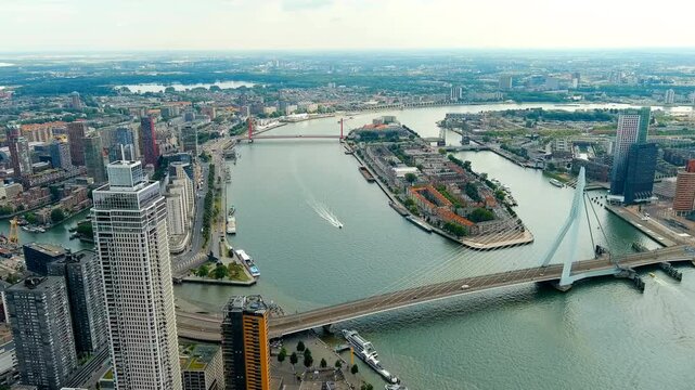 Rotterdam, Netherlands. Erasmus Bridge. Noordereiland Island. View of the city center. River Nieuwe Maas. Summer day, Rainy clouds. Drone footage, Point of interest