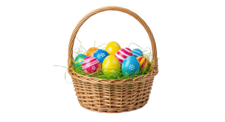 Wicker basket overflowing with colorful decorated Easter eggs on green grass against a black background