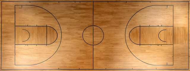 Overhead view of a polished wooden basketball court, showcasing the classic lines and circular center