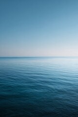 Obraz premium Aesthetic Summer Seascape with Sandy Beach and Gentle Ocean Waves under Warm Sunlight