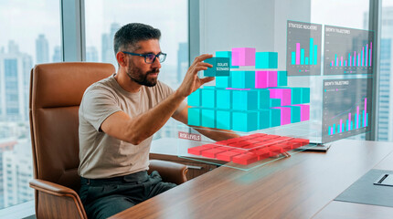 Data analyst adjusting digital risk and growth charts inside a modern office