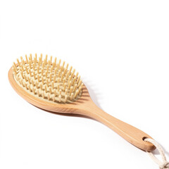 Natural wooden hair brush with bamboo pins and handle on white background, eco-friendly haircare tool for detangling and styling