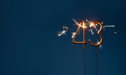 43 years celebration festive background made with Bengal fires in the form of number Forty three.