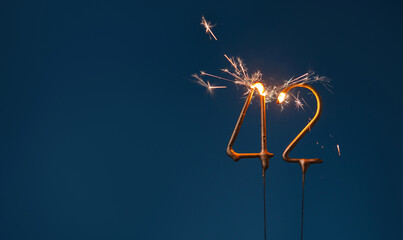 42 years celebration festive background made with Bengal fires in the form of number Forty two.
