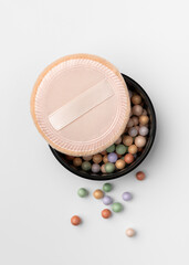Natural Makeup Powder Pearls with Soft Applicator on Light Background