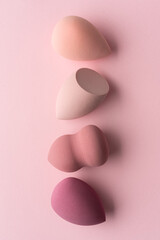 Pastel Makeup Sponges on Pink Background Minimal Beauty Concept