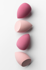 Minimal Pink Makeup Sponges in Vertical Abstract Composition