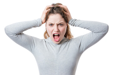 Woman showing frustration while holding her hair with both hands indoors