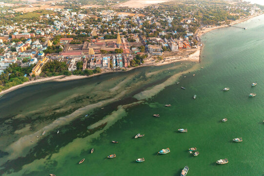 Aerial view of the ancient temple complex meeting the turquoise waters, a dance of earth and sea, Dhanushkodi, Tamil Nadu, India.