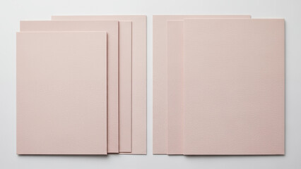 Neatly arranged stack of pink hand-written letter papers on soft neutral background