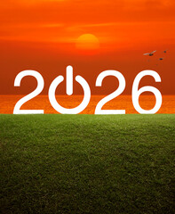 2026 start up business flat icon on green grass field over sunset sky and sea, Happy new year 2026 success concept