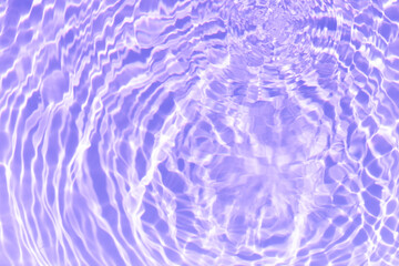 Purple water bubbles on the surface ripples. Defocus blurred transparent pink colored clear calm water surface texture with splash and bubbles. Water waves with shining pattern texture background