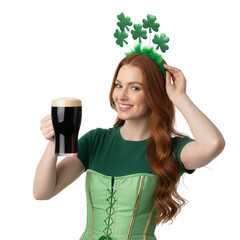 Smiling redhead young woman in a green corset and shamrock headband holding a glass of dark beer for St. Patrick's Day isolated on transparent or white background, png