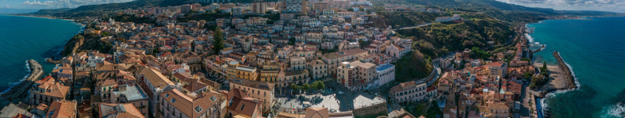 Aerial view of Pizzo Calabro, pier, castle, Calabria, tourism Italy. Panoramic view of the small town of Pizzo Calabro by the sea. Houses on the rock. On the cliff stands the Murat Aragonese castle