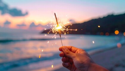Hand holding a burning candle and fireworks creates a bright gold sparkle against a dark night city street with blurry Christmas tree lights and festive holiday bokeh celebration
