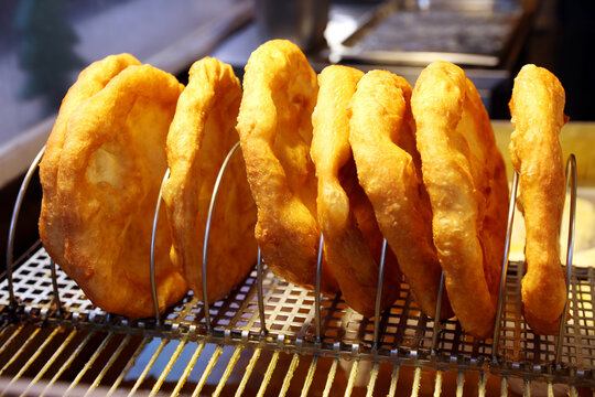 Freshly baked traditional hungarian langos langosch langosh in row for sale