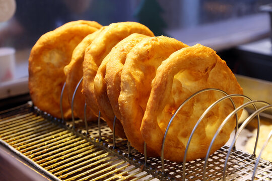 Freshly baked traditional hungarian langos langosch langosh in row for sale