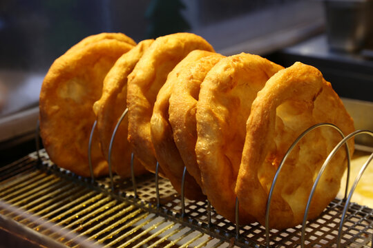 Freshly baked traditional hungarian langos langosch langosh in row for sale