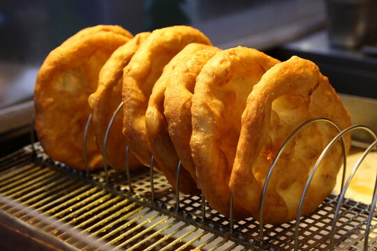 Freshly baked traditional hungarian langos langosch langosh in row for sale