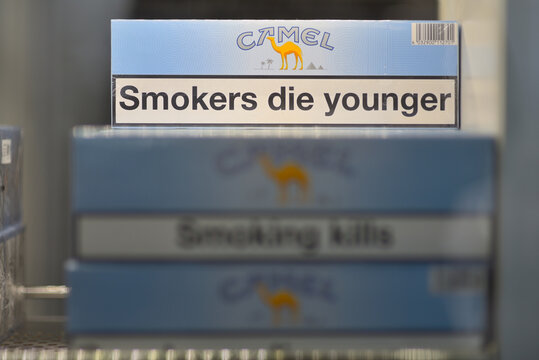 Cigarette Packs with Health Warnings on Display