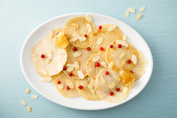 Homemade crepes with honey and almond