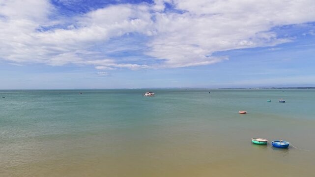 Aerial View Truck of the Basket Boats and a Boat on the Sea in Vietnam.