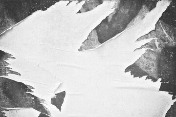 Fototapeta na wymiar Old ripped torn blank black and white fly posters textures backgrounds grunge creased crumpled paper vintage collage placards empty space for text