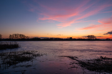Sunset view of the frozen lake