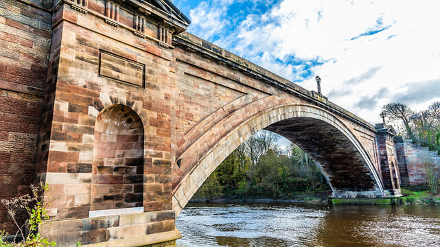 A view looking through the arch of the Grosvenor Bridge up the River Dee in the city of Chester, Cheshire, UK