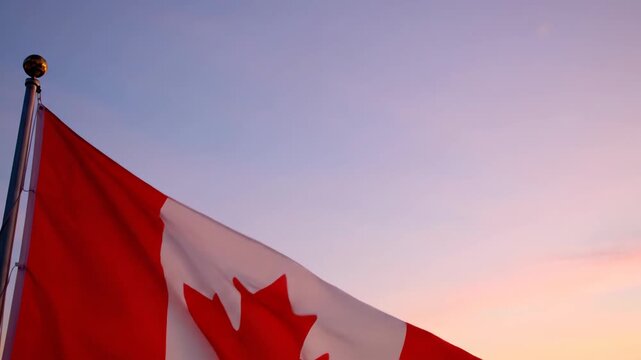 Canadian Flags Flapping majestically against a vibrant sunset sky capturing