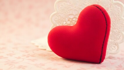 Happy valentine's day wishes with a red heartfelt plush toy