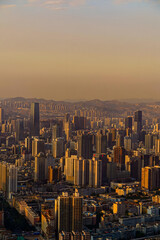 Golden Hour Lanzhou City Skyline with Mountains Backdrop