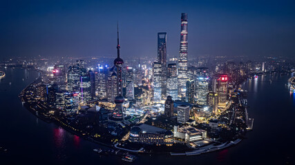 Shanghai Lujiazui Skyline at Night with Illuminated Towers and River Reflections © TranThi