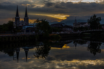 The backdrop of colorful sky lights reflecting off the beautiful river surface at different times...