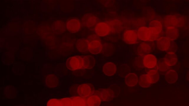 Experience the mesmerizing allure of vibrant red bokeh lights against a dark mysterious background, perfect for adding a touch of dynamic elegance to your creative projects