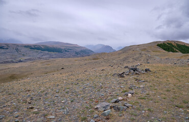 Dramatic view on wild altai mountains. In the background is the valley of the Akkol River.