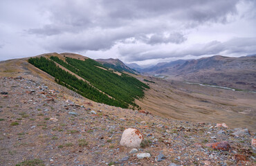 Dramatic view on wild altai mountains. In the background is the valley of the Taldura River.