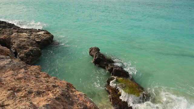 Malta Blue Lagoon landscape. Stunning view of the Blue Lagoon in Comino, Malta, showing the famous turquoise crystal clear waters and the rocky islet of Cominotto under a cloudy sky. 4k video