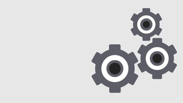 Three grey gears of various sizes are grouped together on a light grey background suggesting a theme of machinery or industrial process in a simple way