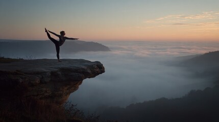 Fototapeta premium Woman practicing yoga on cliff edge